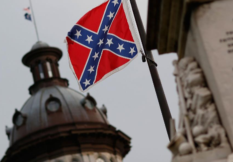New York Gov. Andrew Cuomo (D) on Wednesday signed a bill into law banning the sale or display of Confederate battle flags on st