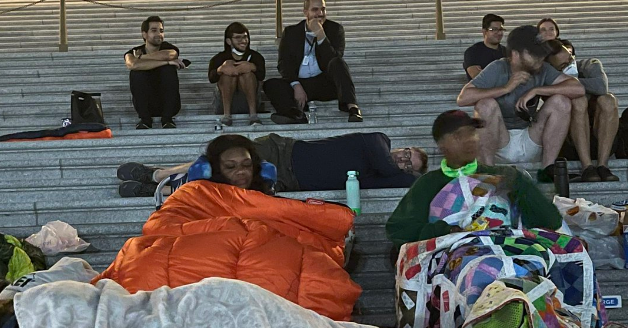 Missouri Congresswoman Cori Bush (shown above left sleeping with homeless advocates outside Congress on Friday night) sent a let